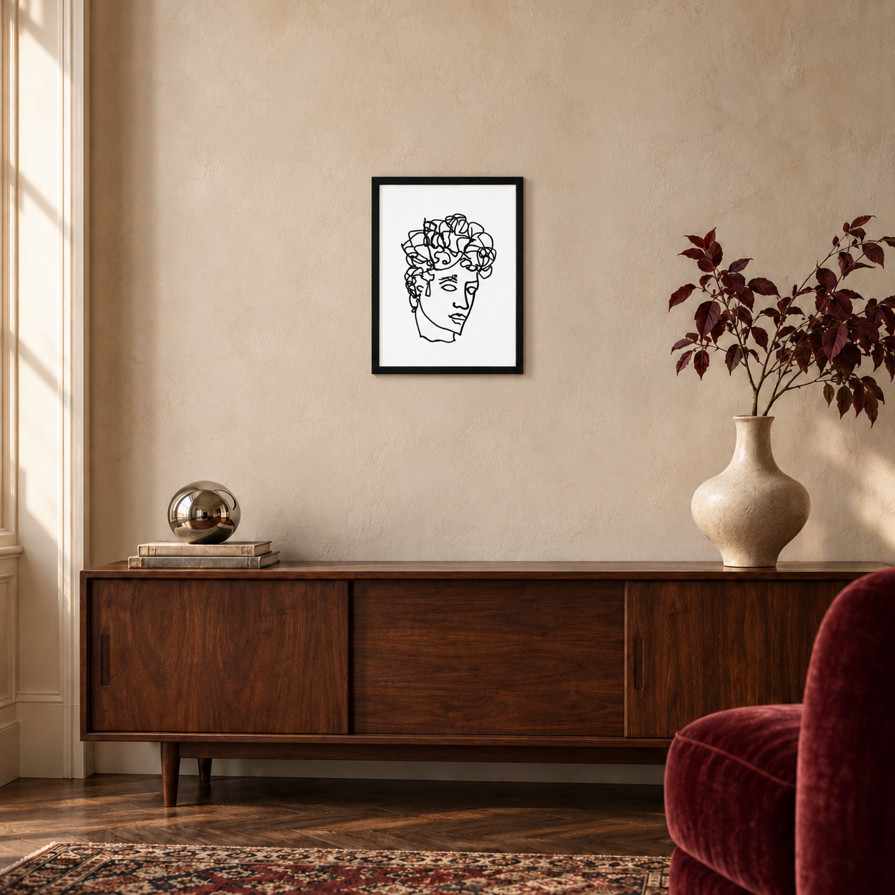 Quirk Antinous ballpoint line drawing in a black 12 × 16 inch portrait frame above a walnut console, shown for styling inspiration