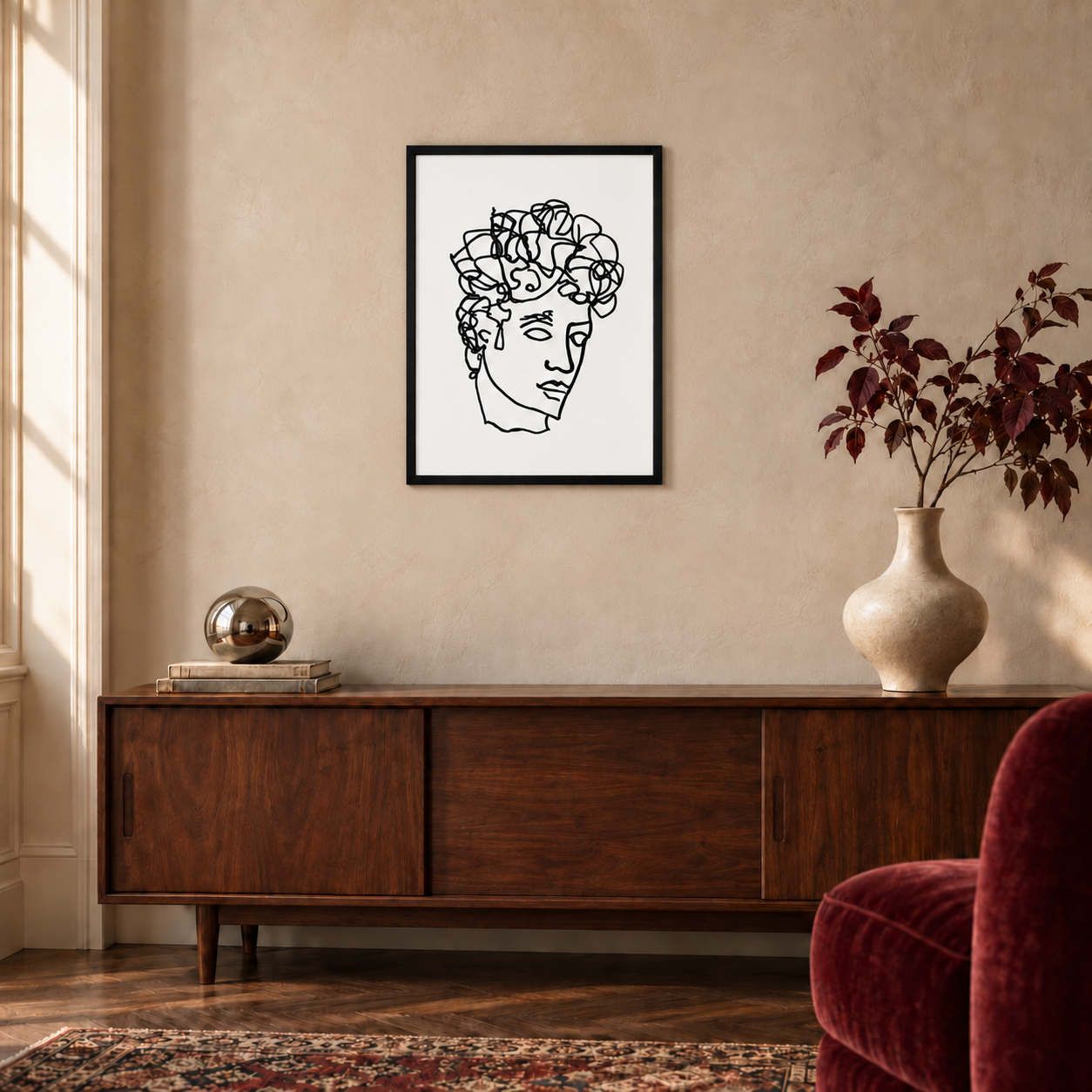 Quirk Antinous ballpoint line drawing in a black 18 × 24 inch portrait frame above a walnut console, shown for styling inspiration