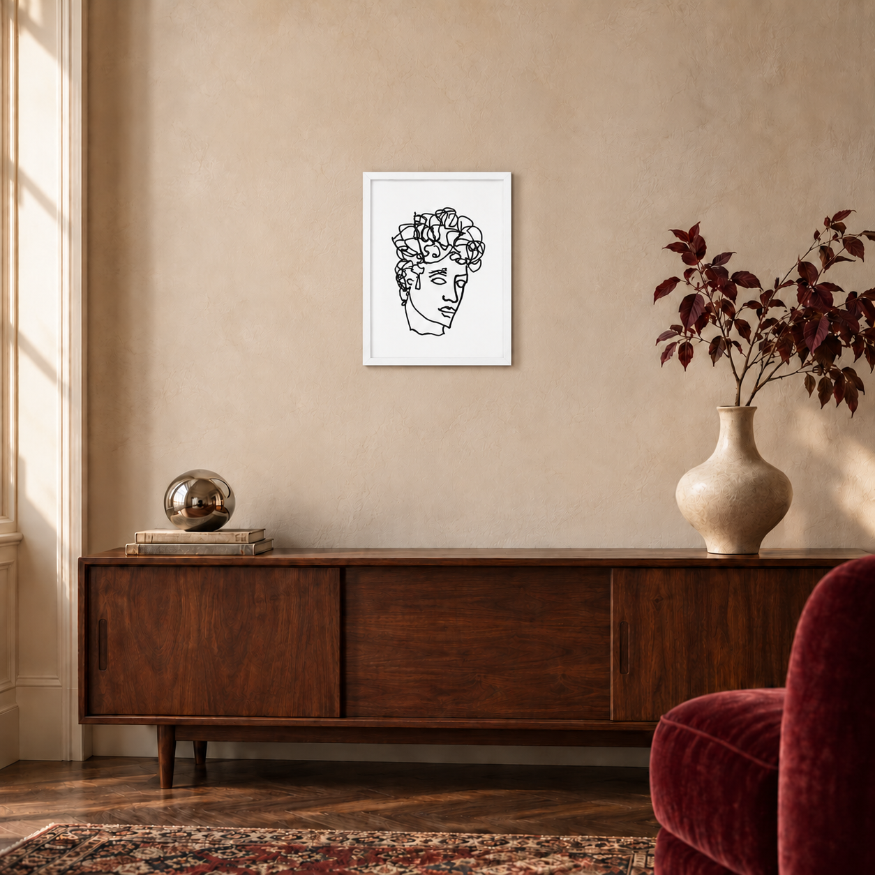 Quirk Antinous ballpoint line drawing in a white 12 × 16 inch portrait frame above a walnut console, shown for styling inspiration