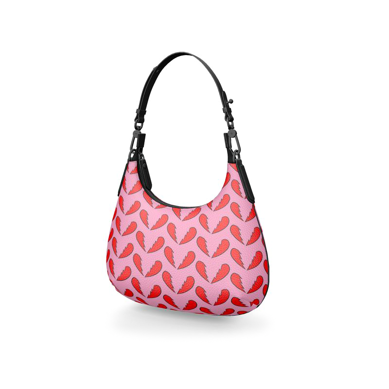 Broken Hearts textured Nappa leather mini curve bag with natural surface highlights, black strap and graphite-tone fittings on white