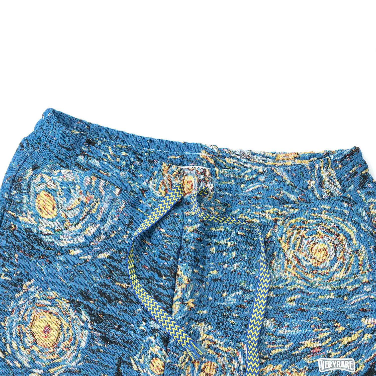 Close view of the Starry Night pants waistband, front pockets and two-color braided drawcords.