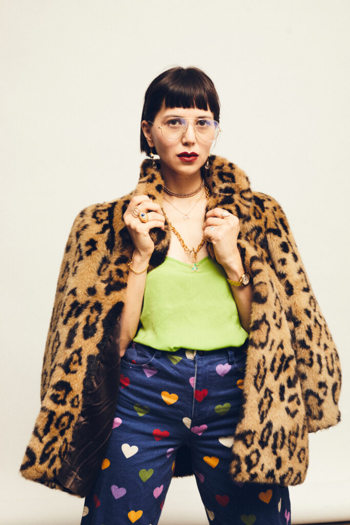 Leopard-print coat styled with a lime top and heart-print trousers