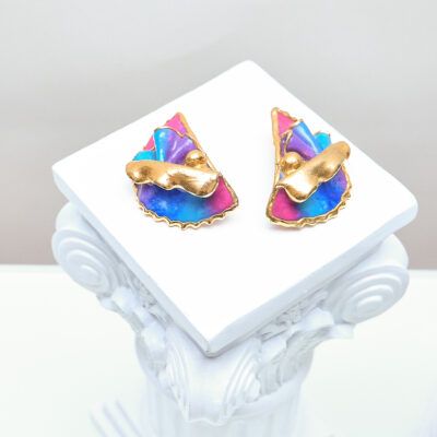 Pair of Amy Lacombe 1988 magenta, blue and violet clip earrings with sculptural gold-plated overlays, front view.