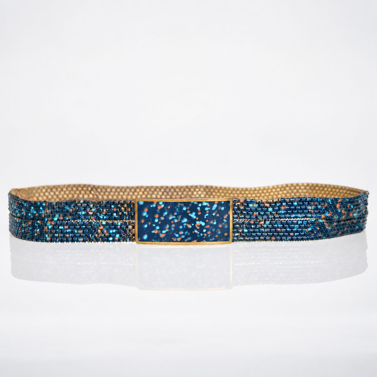 Blue textured belt with a gold-edged confetti buckle