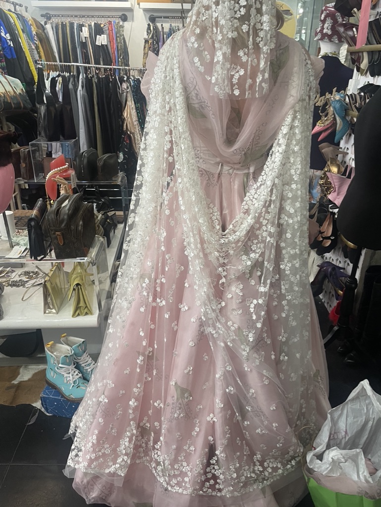 Back fitting view — the draped lace and full skirt.