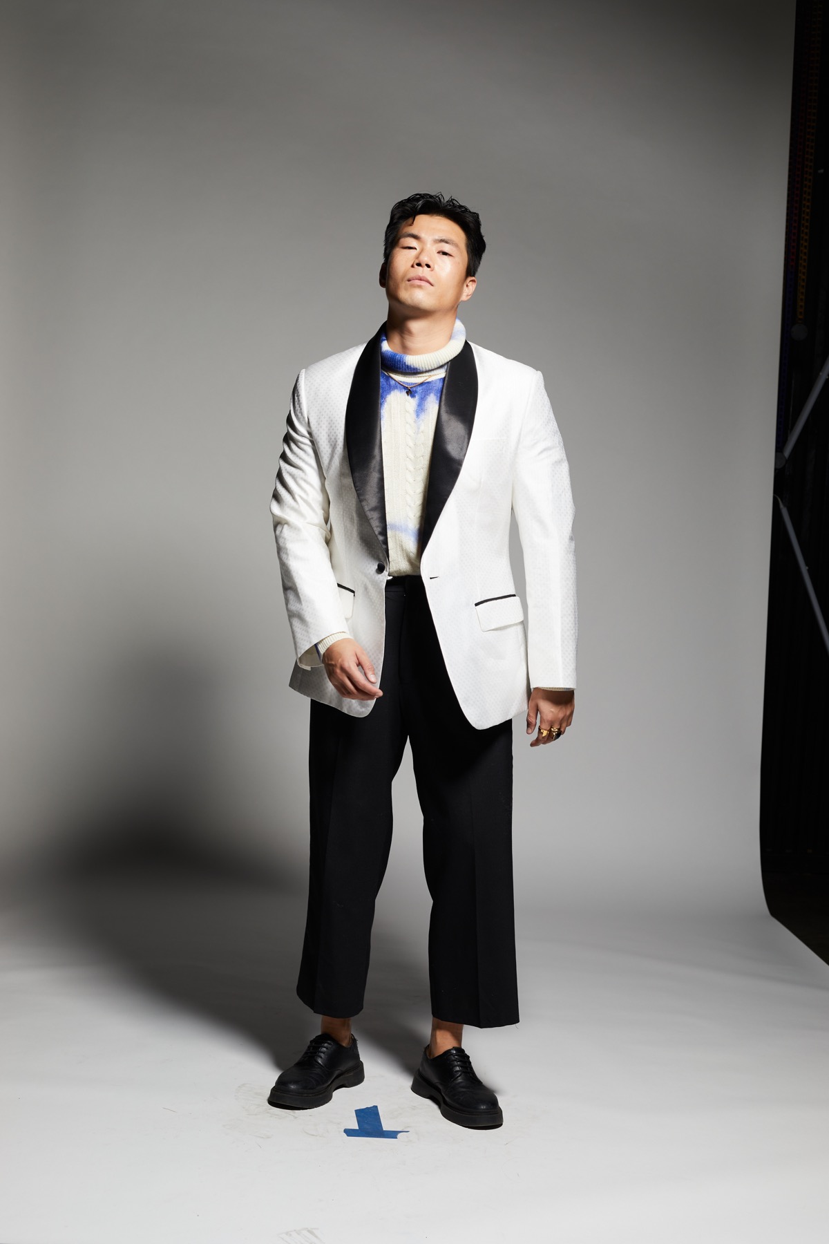 Ty modeling the custom white tuxedo jacket from the front