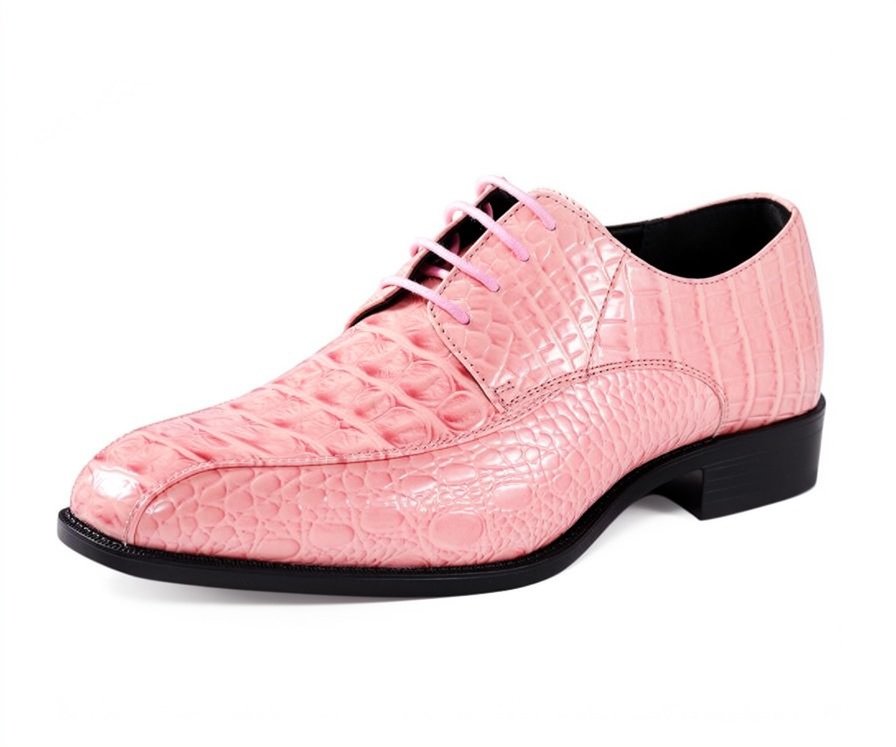 Angled view of an Amali Harvey pink Oxford shoe with a glossy alligator-inspired embossed pattern, matching pink laces and dark low heel.