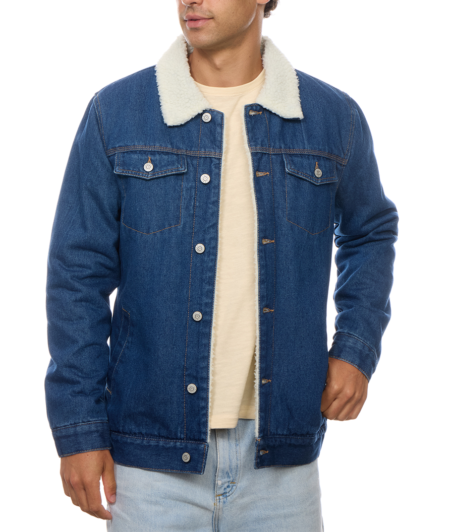 Nose-down alternate front view of the PX denim trucker jacket worn open, showing the contrast collar, lining edge and full sleeve and hem details.