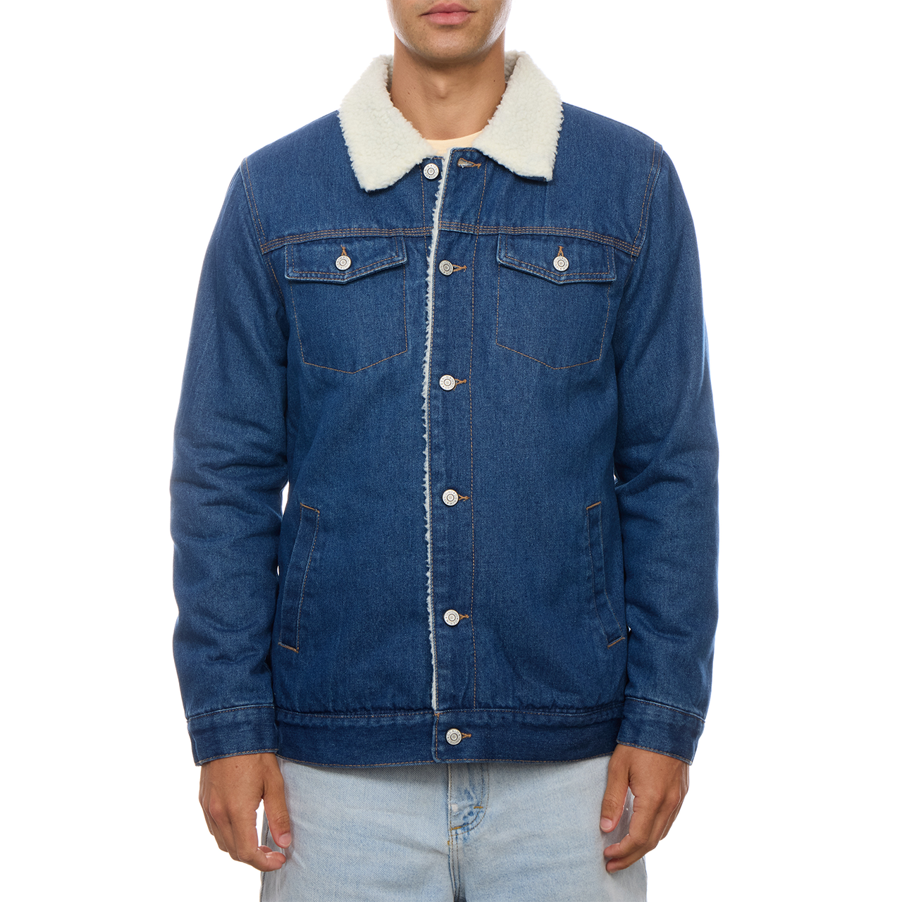 Closer buttoned-front view of the PX denim trucker jacket, showing the contrast collar, chest pockets and seam details.