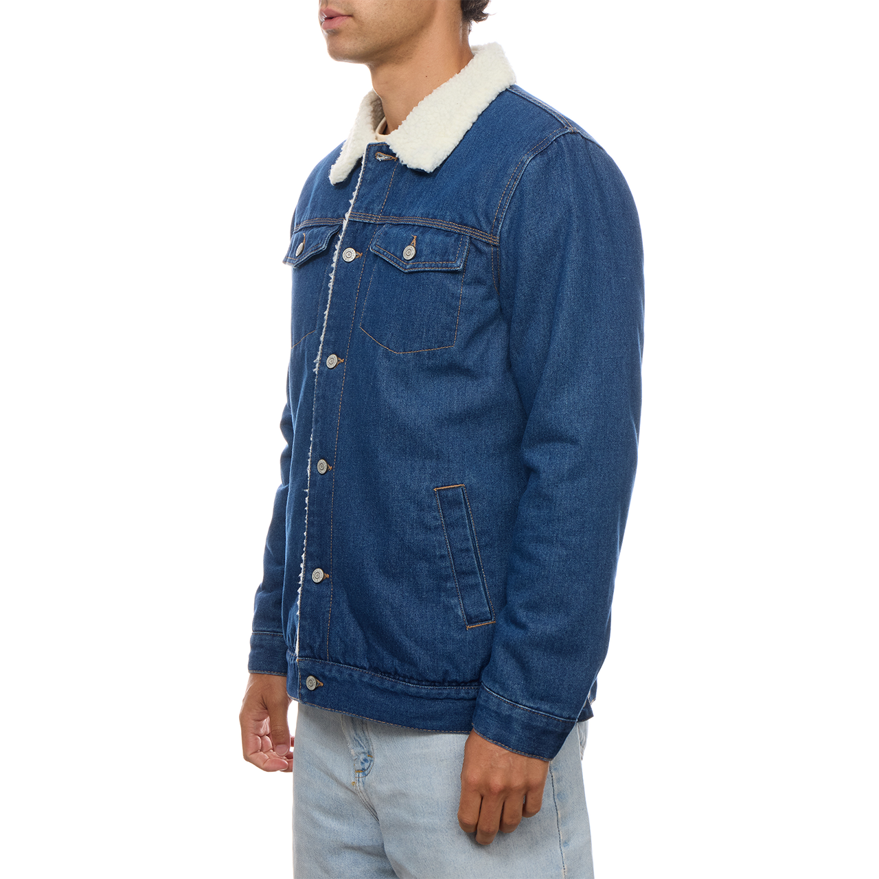 Full side view of a model wearing the PX denim trucker jacket, showing the sleeve, hip-length hem and contrast collar.