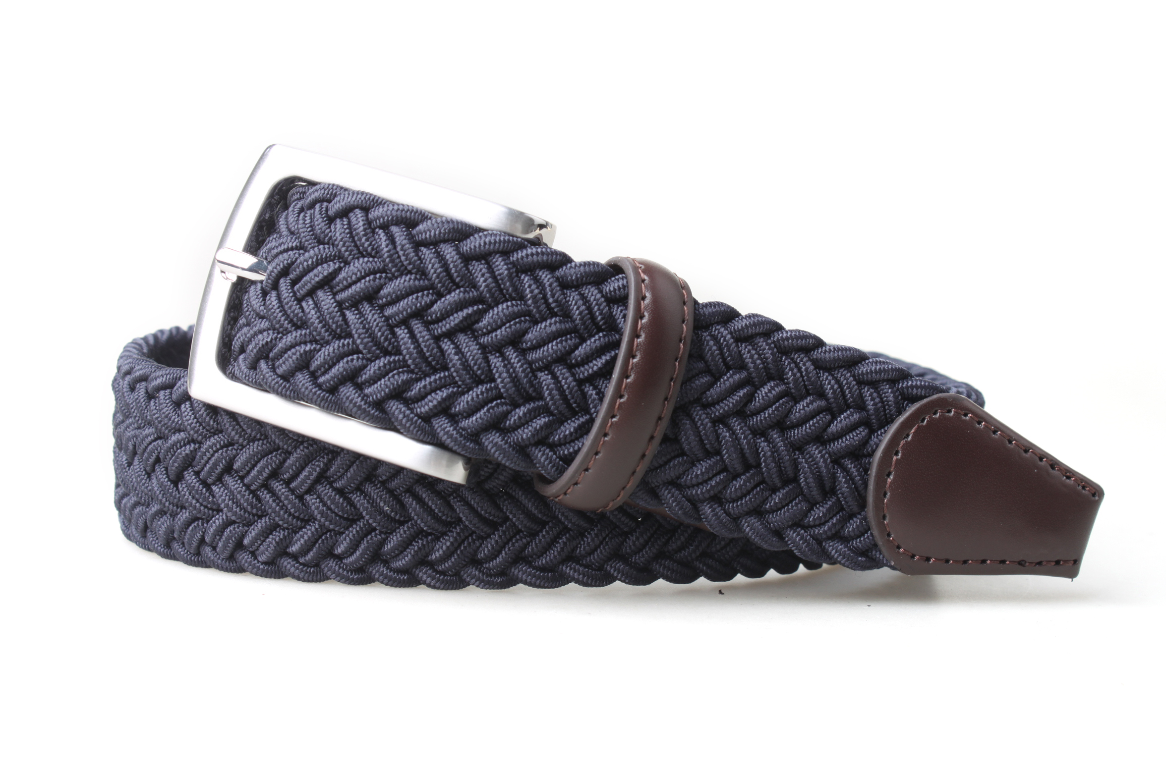 PX navy braided stretch belt coiled from the opposite angle, with brown leather keeper, stitched tip and a satin nickel-finish buckle.