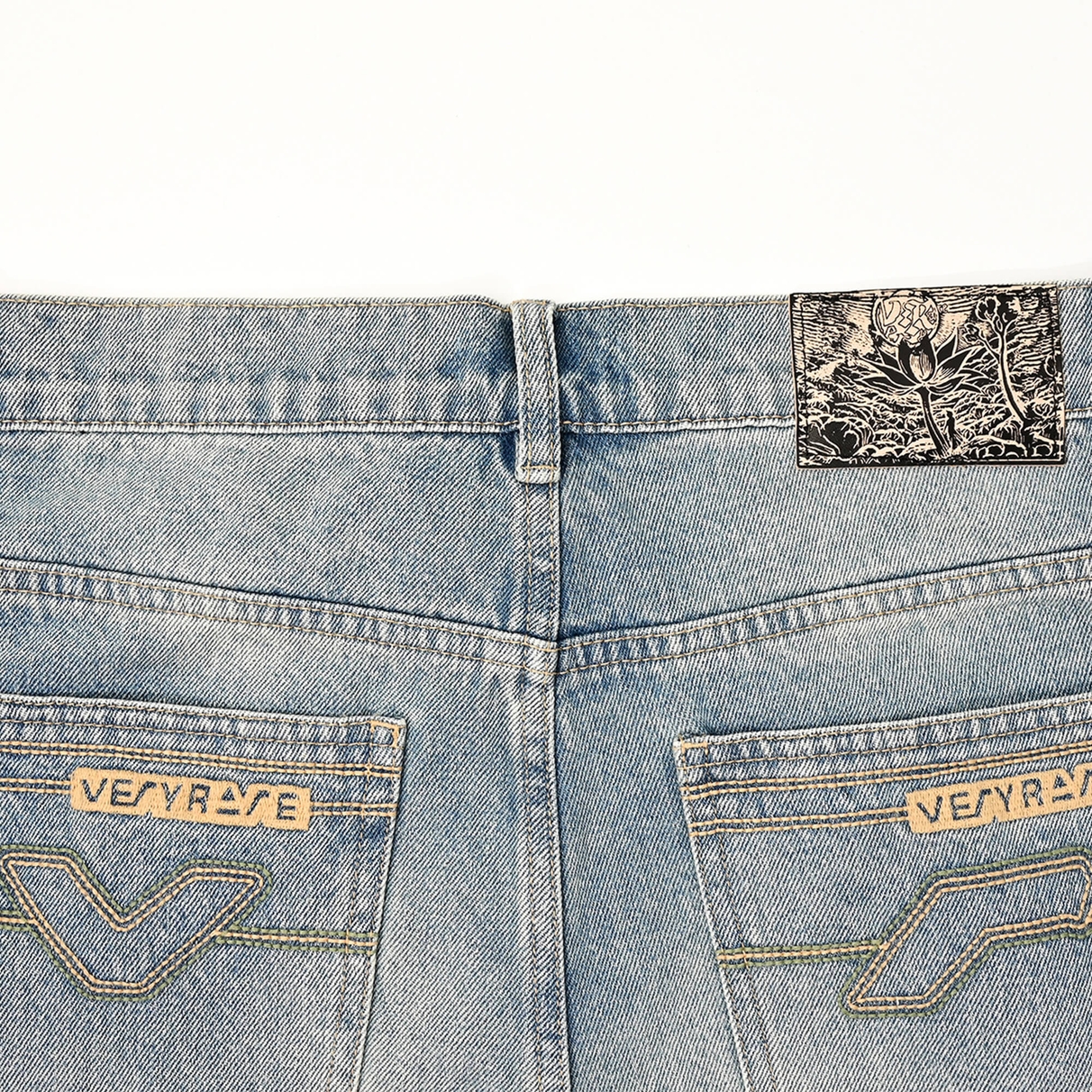 Rear waistband, patterned patch and two embroidered VERYRARE back pockets on Sakura denim pants.