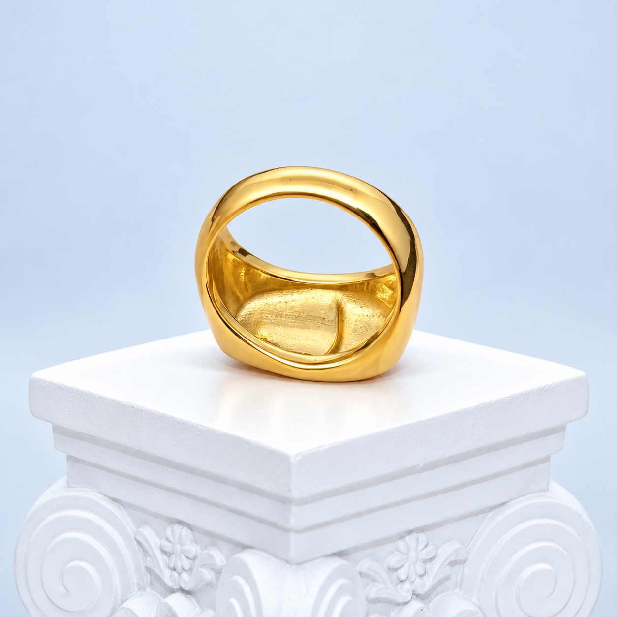 Rear interior of the Mio Queena two-tone face ring showing the gold-plated band and textured casting behind the face